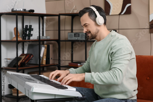 Young happy male composer w...