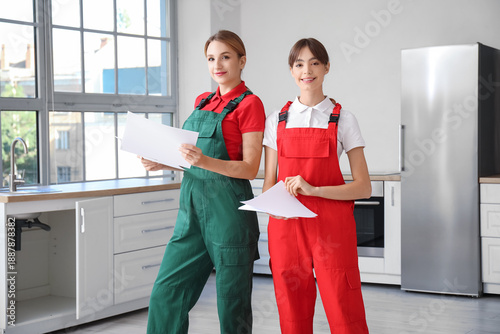 Female workers with furnitu...