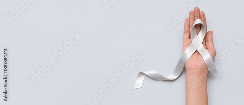 Woman holding awareness rib...