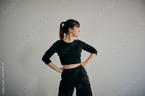 Canvas Print Young Japanese woman performing jazz dance pose with dynamic body movement