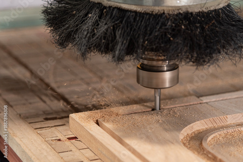 фотографія A CNC router machine is precision-carving wood.