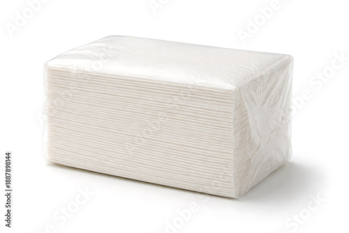 Stack of white paper napkins wrapped in plastic isolated on white background