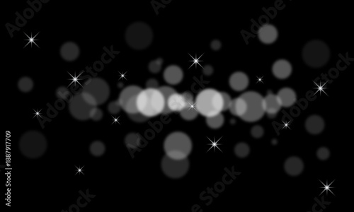 Luxurious white bokeh glitter sparkles on black background with soft glowing light particles and star highlights for elegant overlay abstract cinematic design