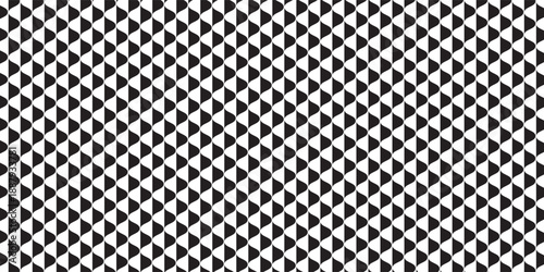 Geometric pattern of black triangles on a white background.Seamless in one direction.Option with an average fade out.The scale transformation method.