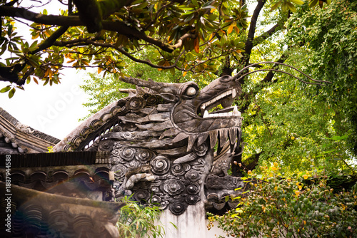 Photography Traditional chinese architecture among trees of Yu garden in Shanghai, China
