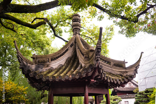 Photography Traditional chinese architecture among trees of Yu garden in Shanghai, China