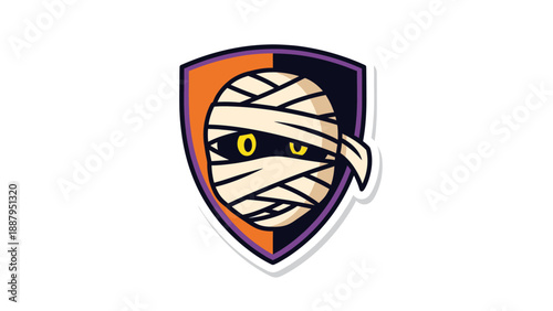 A cartoon mummy's face, wrapped in bandages, in a shield with orange, black, and purple