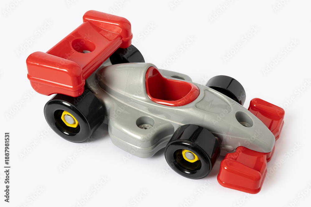 Fototapeta premium Plastic toy racing car with red and silver colors isolated on white background