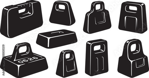 Collection of black dumbbells and weights for fitness training