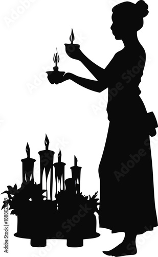 Silhouette Of A Woman Lighting Candles