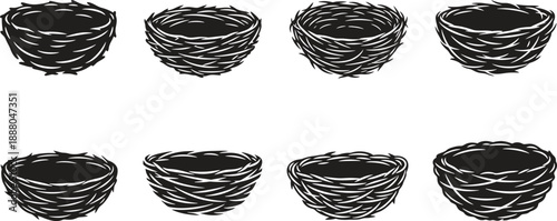 Eight black woven baskets arranged in two rows on a white background