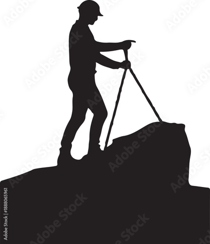 Silhouette of a surveyor on a rocky outcrop geology