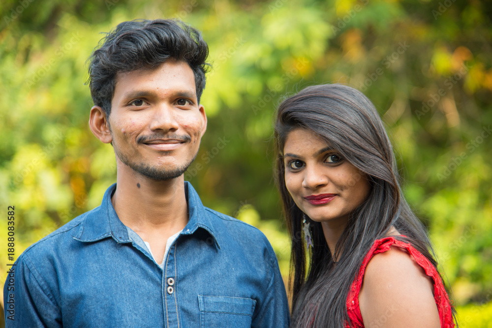 Fototapeta premium Portrait of happy brother and sister at outdoor