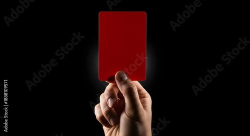Referee Hand Holding Red Card for Penalty Send Off