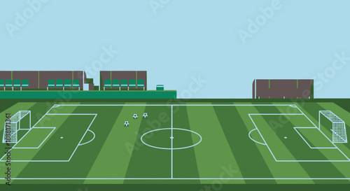 Empty Green Football Field in Outdoor Stadium with Goalposts and Stands Under Blue Sky