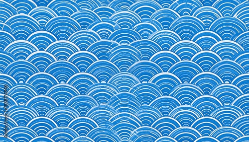 Traditional Japanese Seigaiha wave pattern in blue and white with a hand-painted texture.