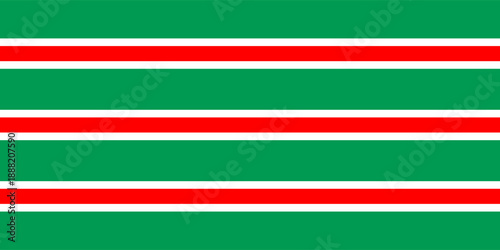Christmas seamless pattern. Red and green diagonal stripes background. Candy cane repeating decoration wallpaper. Winter holiday lines backdrop.