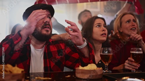 Disappointed sports fans reacting negatively to losing game