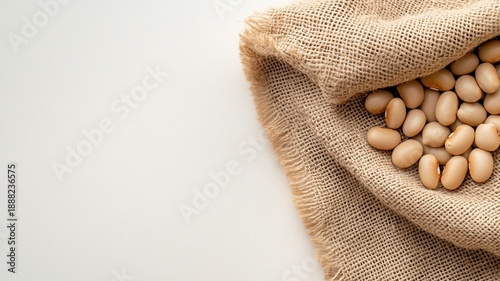 Mixed beans filling a burlap sack, representing healthy nutrition, plant based and agriculture protein, sustainable