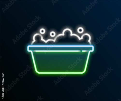 Glowing neon line Baby bathtub with foam bubbles inside icon isolated on black background. Colorful outline concept. Vector