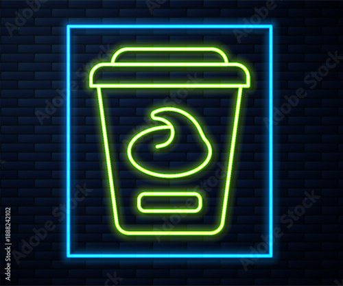Glowing neon line Yogurt container icon isolated on brick wall background. Yogurt in plastic cup. Vector