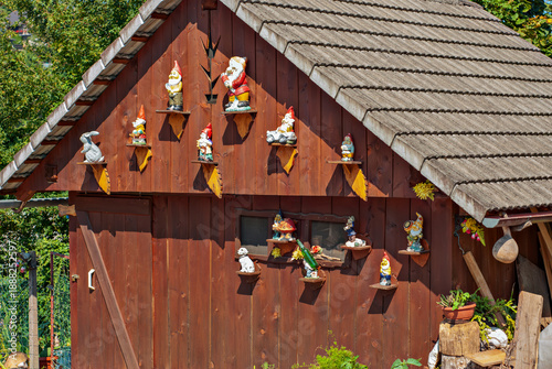 Wallpaper Mural Garden gnomes on wooden shed wall, rustic outdoor collection Torontodigital.ca