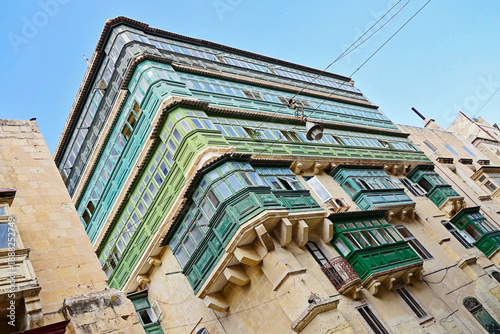 Wallpaper Mural Green gallarija balconies on corner building in Valletta Malta Torontodigital.ca