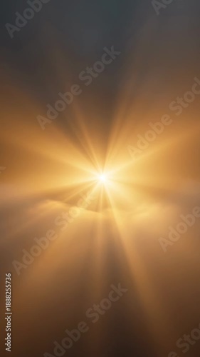 Golden sunburst over clouds with ethereal light rays shining through hazy atmospheric conditions, creating a celestial scene