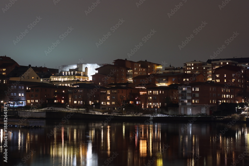 Fototapeta premium Sweden. Embankment on the river Motala stream in the city of Norrkoping. City of Norrkoping. Night city for New Year. Province of Östergötland. 