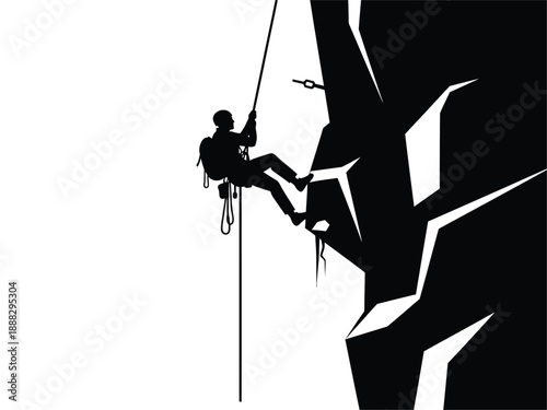 Silhouette of a climber rappelling down a steep rock face.
