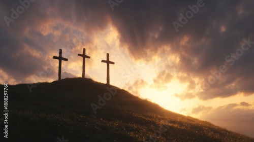 Three crosses stand on a hill under a cloudy sky at sunset
