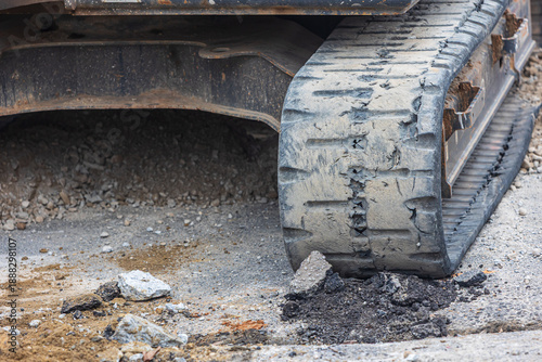 Closeup of worn tire tread on earth mover construction equipment