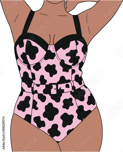 Curvy woman in pink and black cow print one piece swimsuit with belt standing against white background for body positive summer fashion and swimwear concept.