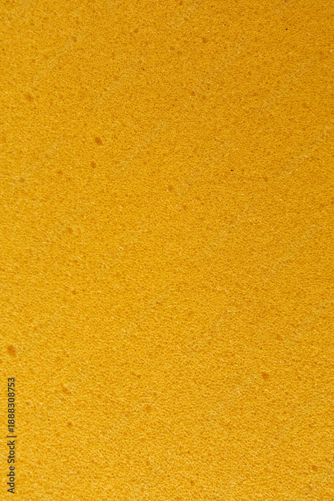 Fototapeta premium Yellow porous foam texture background