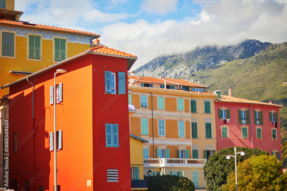 Fototapeta premium Brightly painted traditional residential buildings with colorful shutters in Menton, France