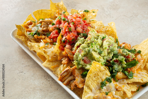 Bild auf Leinwand A view of a plate of dairy-free, gluten-free nachos pollo asado.