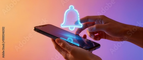 デジタル通知ベルを操作する手元のスマートデバイス