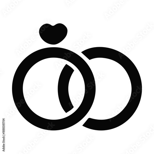 Symbolic black silhouette of two interconnected wedding bands, one adorned with a heart, representing everlasting love, commitment, and the joyous union of marriage