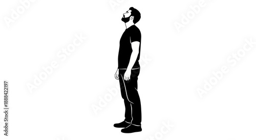 Silhouette of a Man Standing and Looking Up in a Black T-Shirt and Jeans