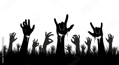 Silhouette of Zombie Hands Rising from Grass in a Spooky Halloween Concept