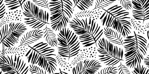 Black and white tropical leaf pattern with scattered dots