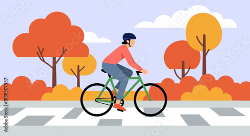 Person riding bicycle on road during autumn season.