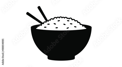 A black bowl filled with rice and chopsticks a striking silhouette