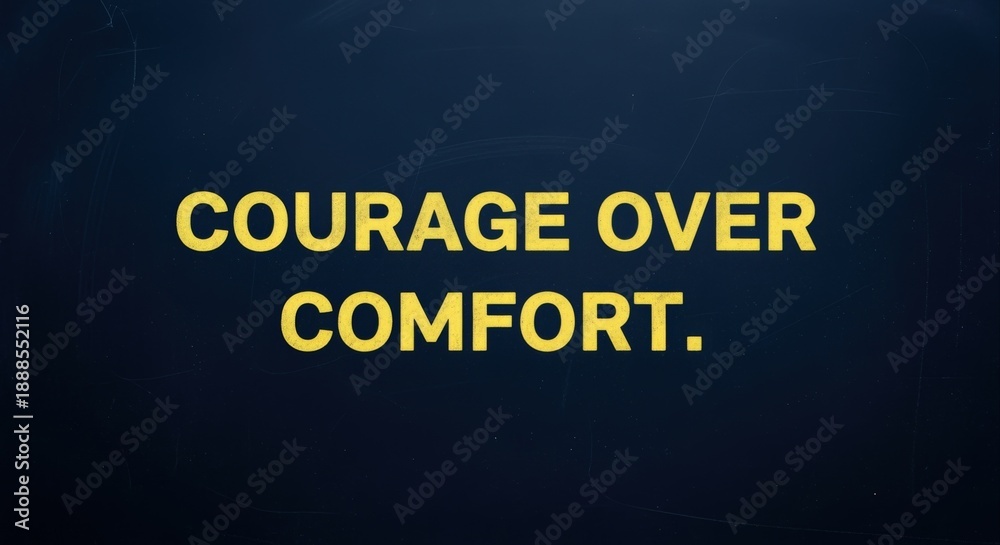 Fototapeta premium Courage Over Comfort Motivational Quote on Dark Blue Background to Inspire Strength and Determination