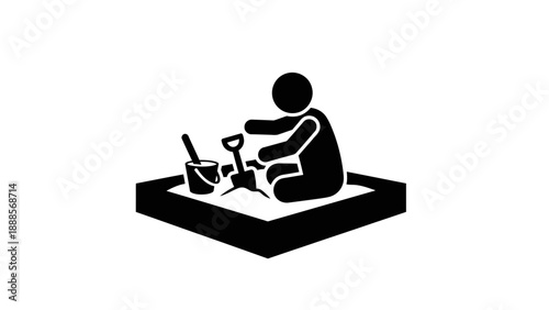 Child playing in sandbox with shovel and bucket.