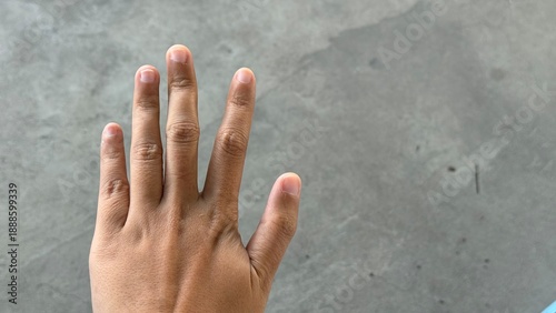 Принти на полотні A hand with fingers spread open, showing short natural nails and light brown skin