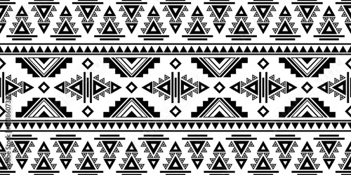 Geometric ethnic seamless pattern featuring tribal symbols, arrows, and linear ornaments