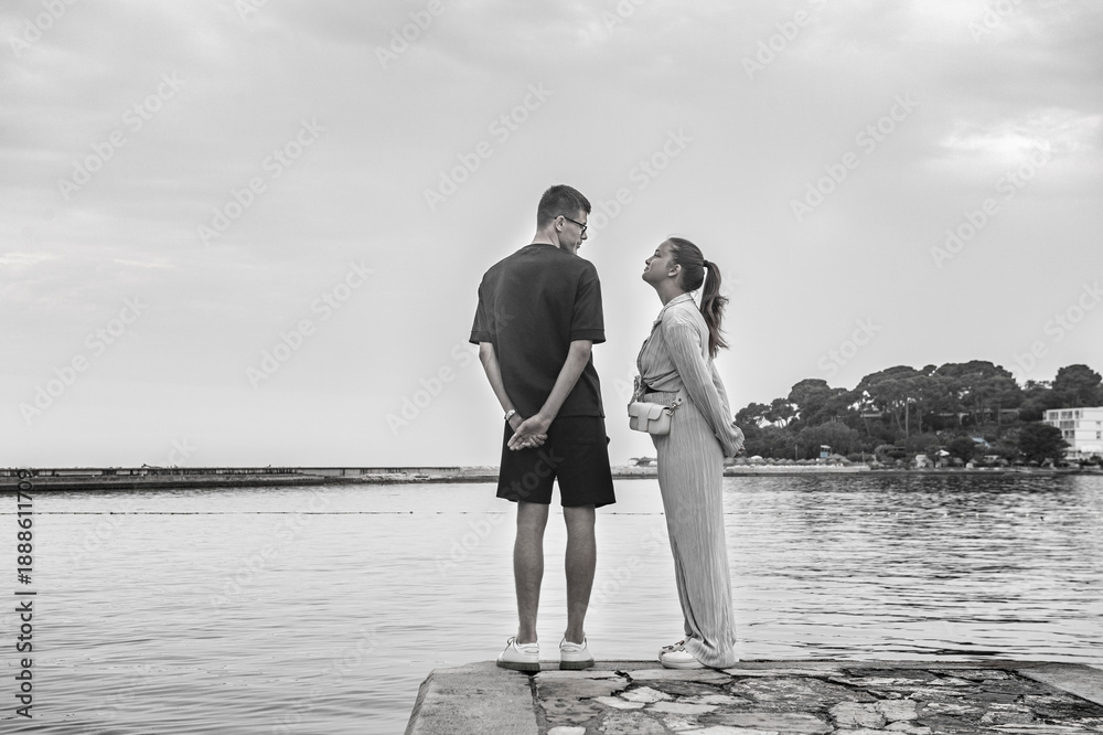 Fototapeta premium A couple in love stands on the seashore. Porec, Istrian Peninsula, Croatia