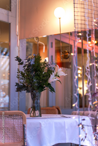 Wallpaper Mural table with lily bouquet on outdoor terrace Torontodigital.ca