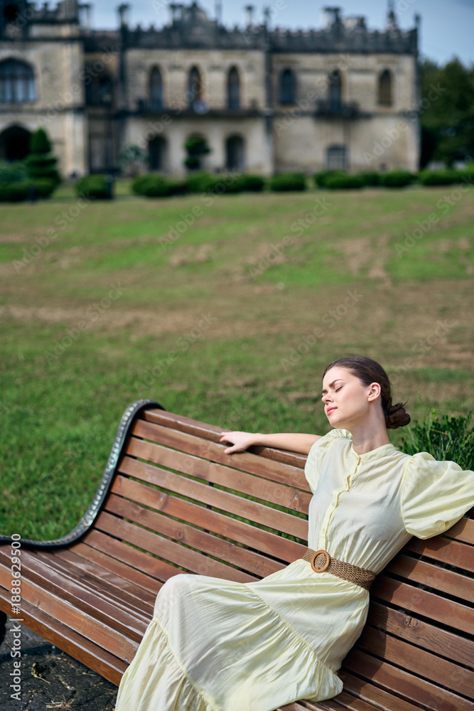 Fototapeta premium Woman bench park vintage dress manor